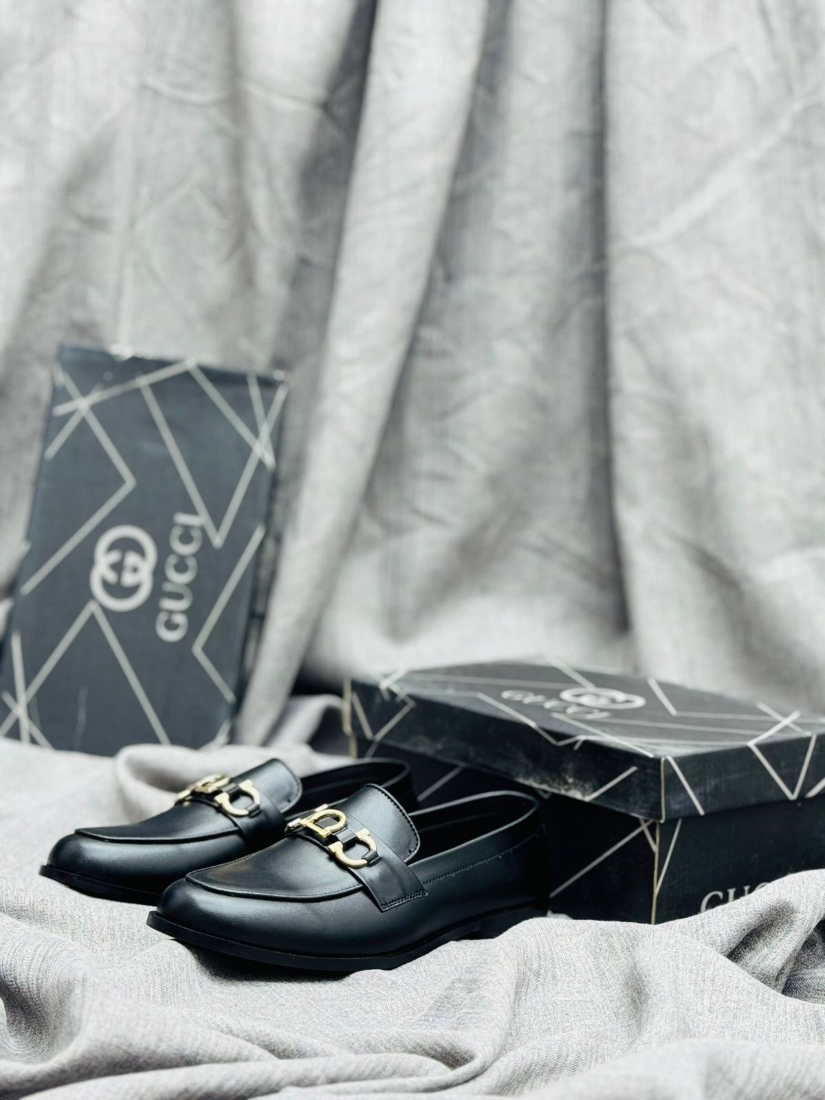 Gucci luxury Black Leather Loafers with Gold Buckle – Premium Elegance